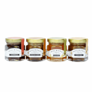 Pack de mini mieles artesanales Miel de Oro infusionadas con canela, cúrcuma y jengibre, en frascos gourmet de 50 g.